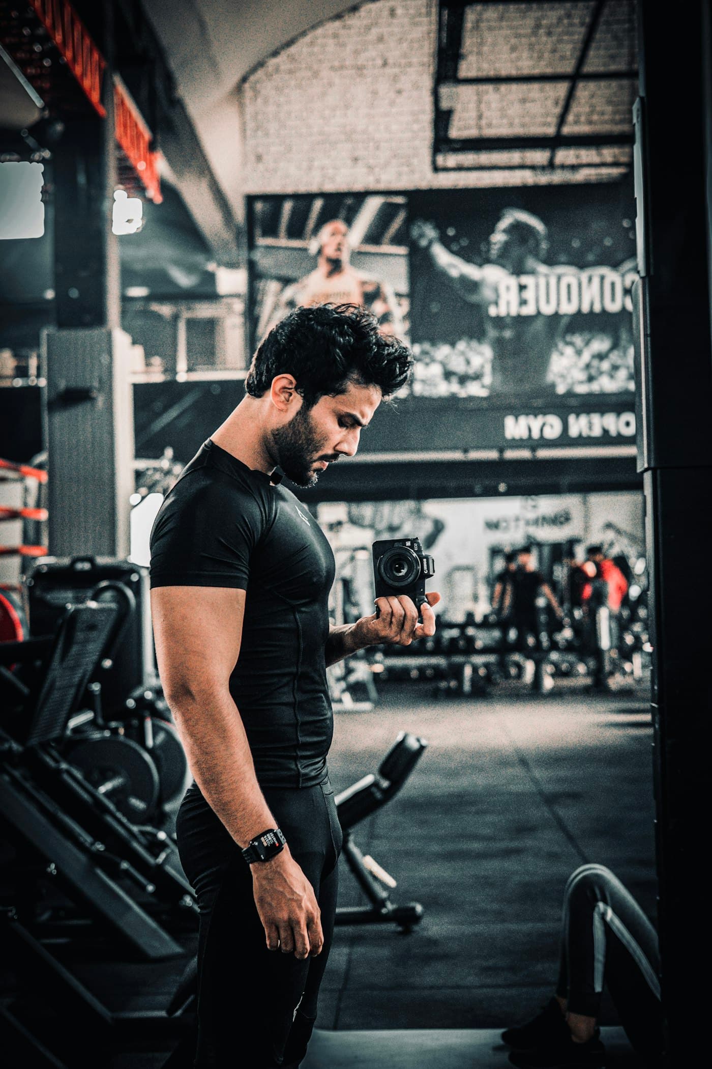 Motus member reviewing their session in a gym mirror